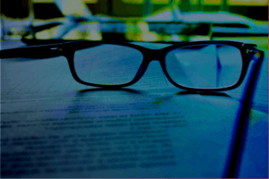 Reading glasses on paper