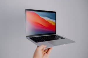 Person holding laptop
